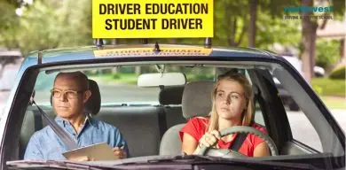 Student driver driving car with instructor