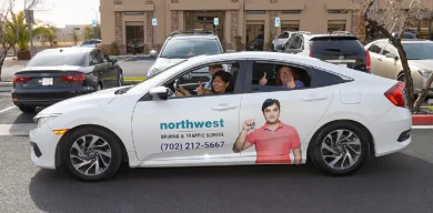 Driving school car with happy students, highlighting Need To Know Before Taking Driving Lessons at Northwest Driving School.