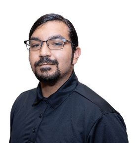 A man with glasses and a beard wears a black polo shirt, posing against a plain black background.