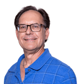 Smiling man with glasses wearing a blue polo shirt, against a plain background.
