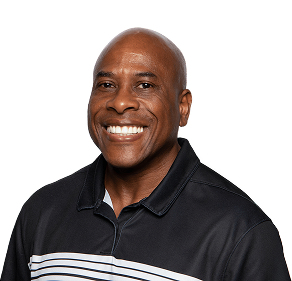 Smiling man in a black polo shirt with white stripes, against a plain background.