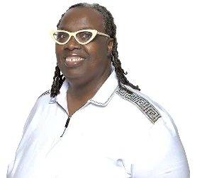 Simone Ranson smiles confidently, wearing stylish glasses and a white shirt with decorative details.