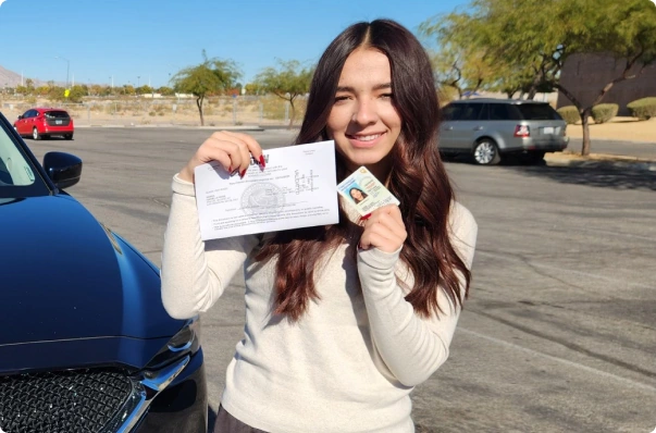 Las Vegas Driving School student from Northwest Driving School celebrating passing the driving test with license in hand