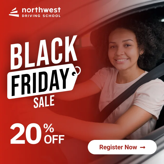 A smiling person in a car promotes a Black Friday sale with 20% off at Northwest Driving School.